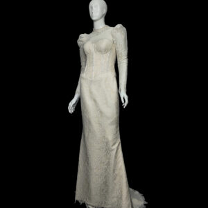 Front angle of elegant ivory lace wedding dress featuring puffed shoulders, corset bodice, and high neckline – bespoke design by Skyleros Boutique
