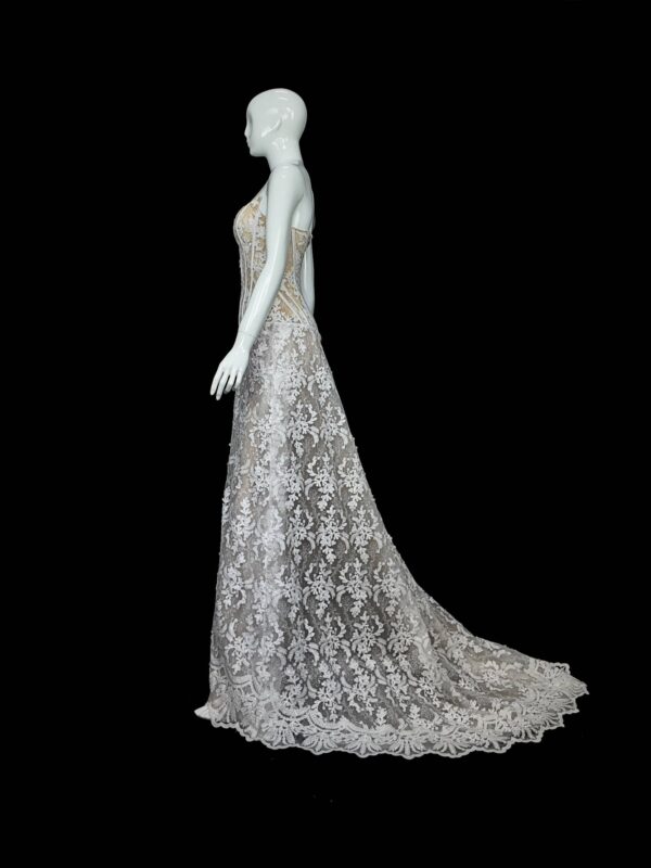 Full-length view of the Marble Lace wedding dress, showcasing the fitted silhouette and elegant train.