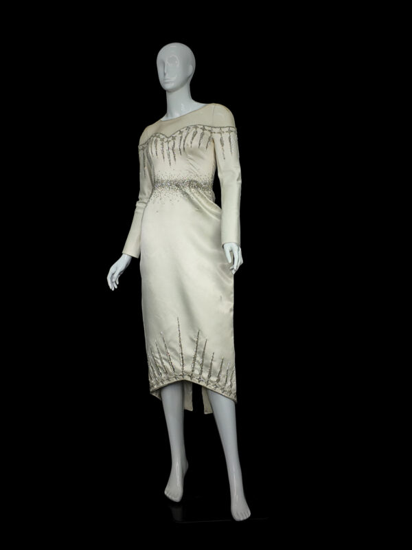 Bride wearing the Sovanara Princess off-shoulder ball gown wedding dress, showcasing the voluminous tulle skirt and floral appliqué bodice in a bright, elegant setting.