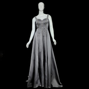 Full-length view of the Moon Dance wedding gown, highlighting the dramatic mermaid flare and elegant satin train.