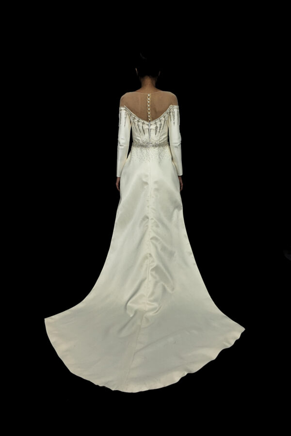 Back view of the Sovanara Princess wedding dress, displaying the elegant train and detailed lace-up bodice.